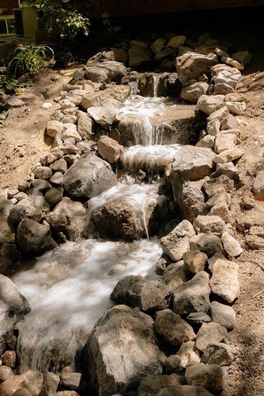 Hyde Park Transformation into Family Waterfall Retreat